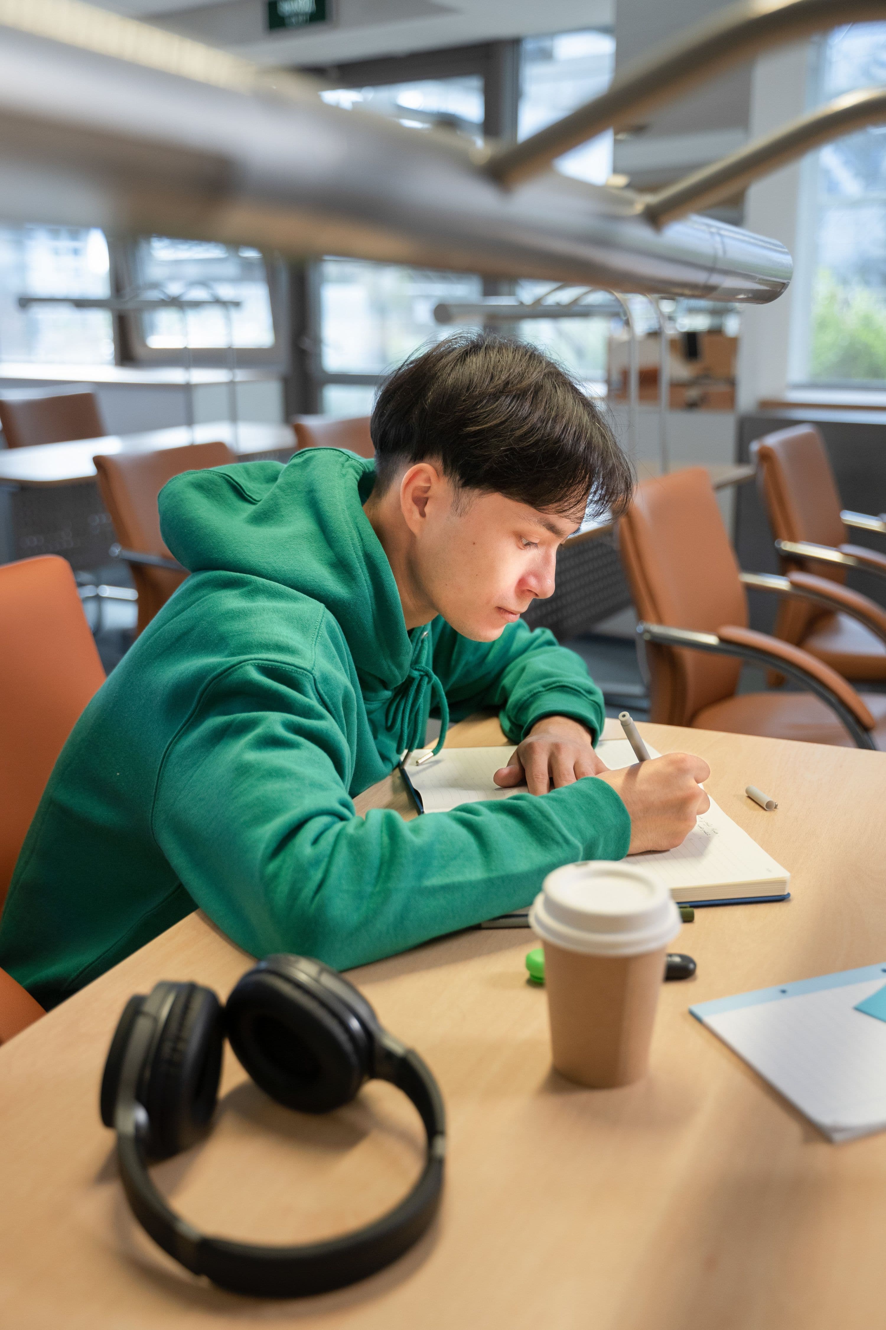 side-view-student-writing-notebook