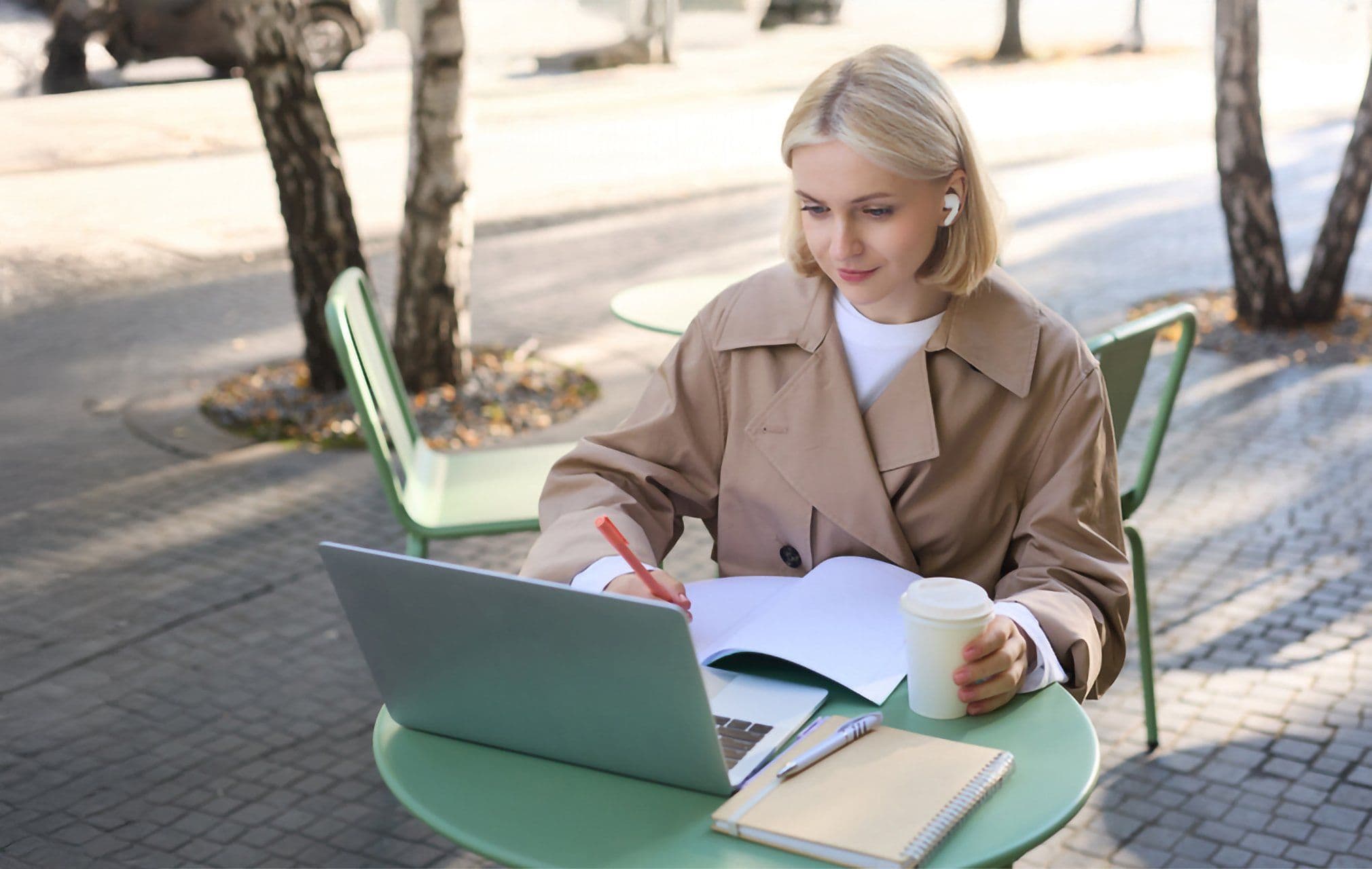 portrait-beautiful-blond-woman-wearing-wireless-headphones-using-laptop-studying-outdoor_720